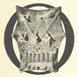A monochrome artwork of an intricate ornament or design, framed within an oval.