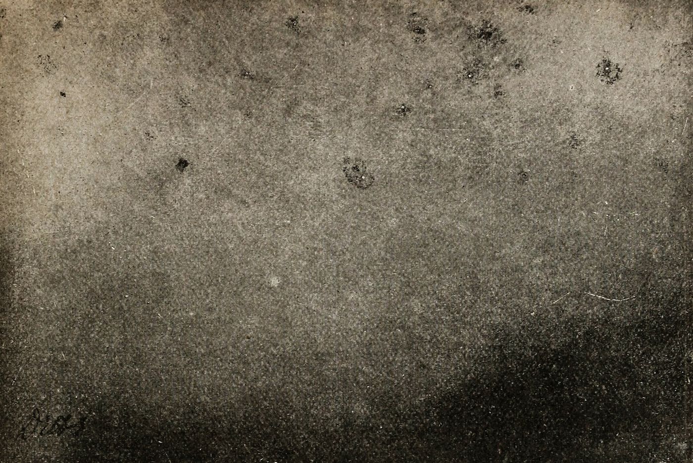 A heavily textured, vintage-looking background with mottled patterns in sepia, brown, and black.