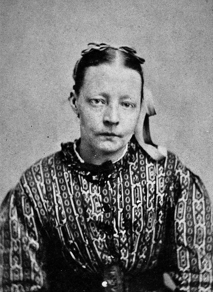 A vintage black and white portrait of a person with a unique style.