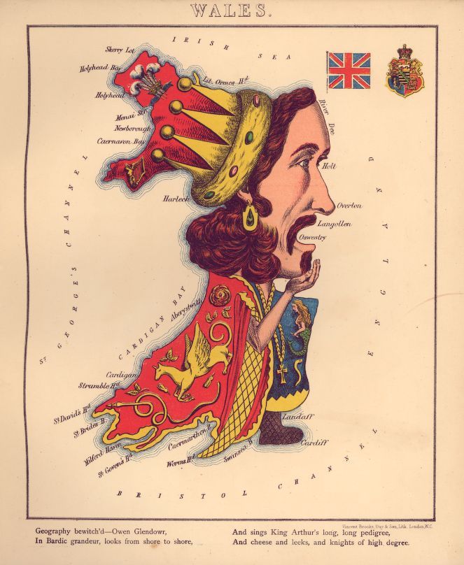 Vintage map of Wales shaped like a man's head wearing a crown, with a red dragon across his chest and a Union Jack flag in the corner.