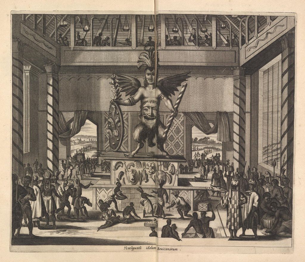 A detailed black and white engraving depicting a religious or ceremonial scene with a large idol on a raised platform, surrounded by figures engaged in worship or ritualistic activities, set within a grand architectural structure.