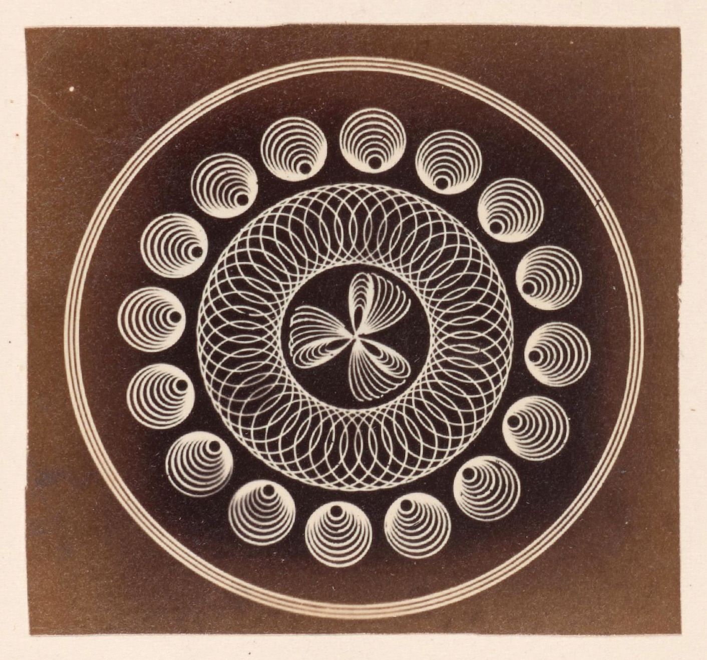 A sepia-toned photograph of a complex geometric design featuring concentric circles, spirals, and intricate woven lines.