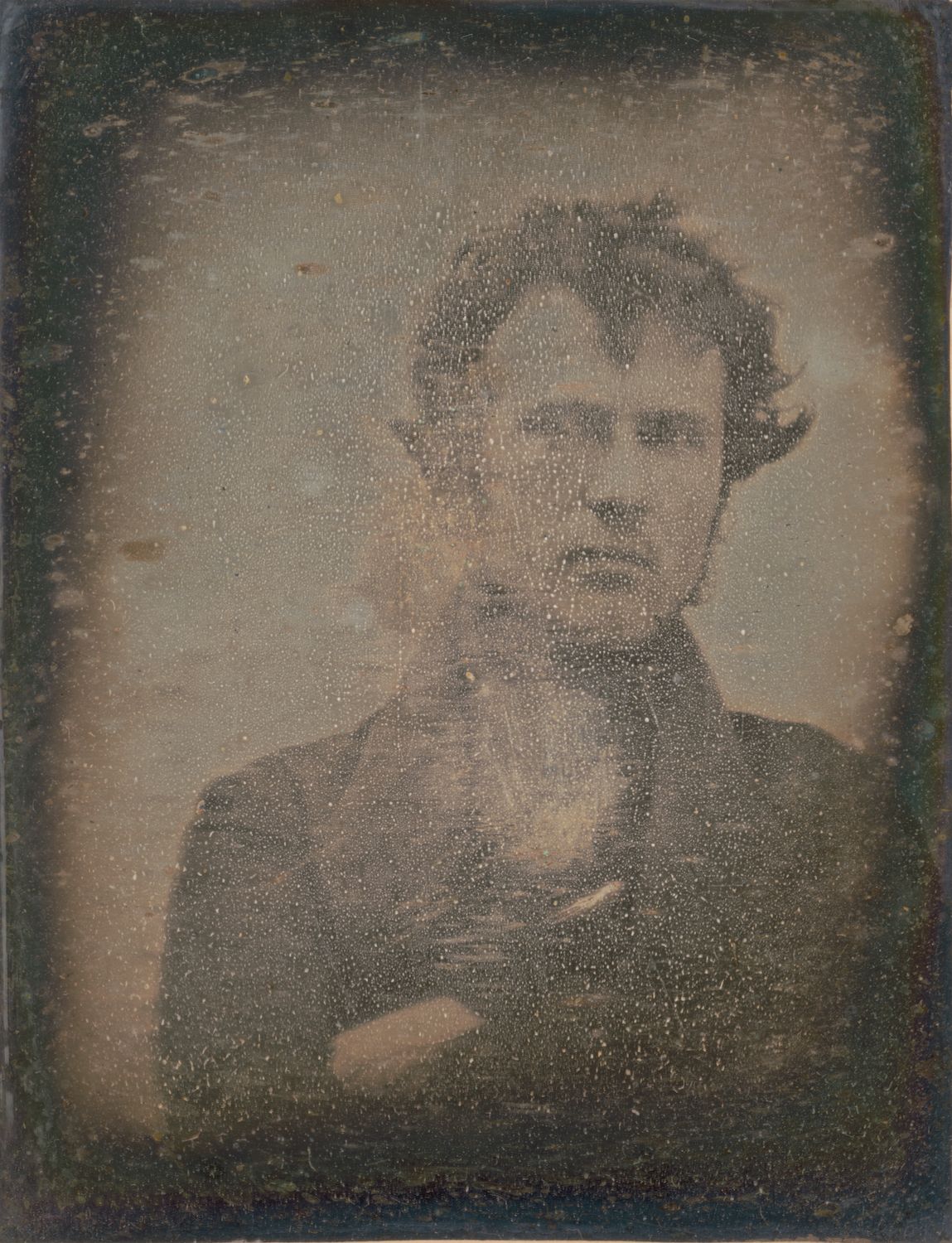 A vintage-style portrait of a man in a dark suit with a serious expression.