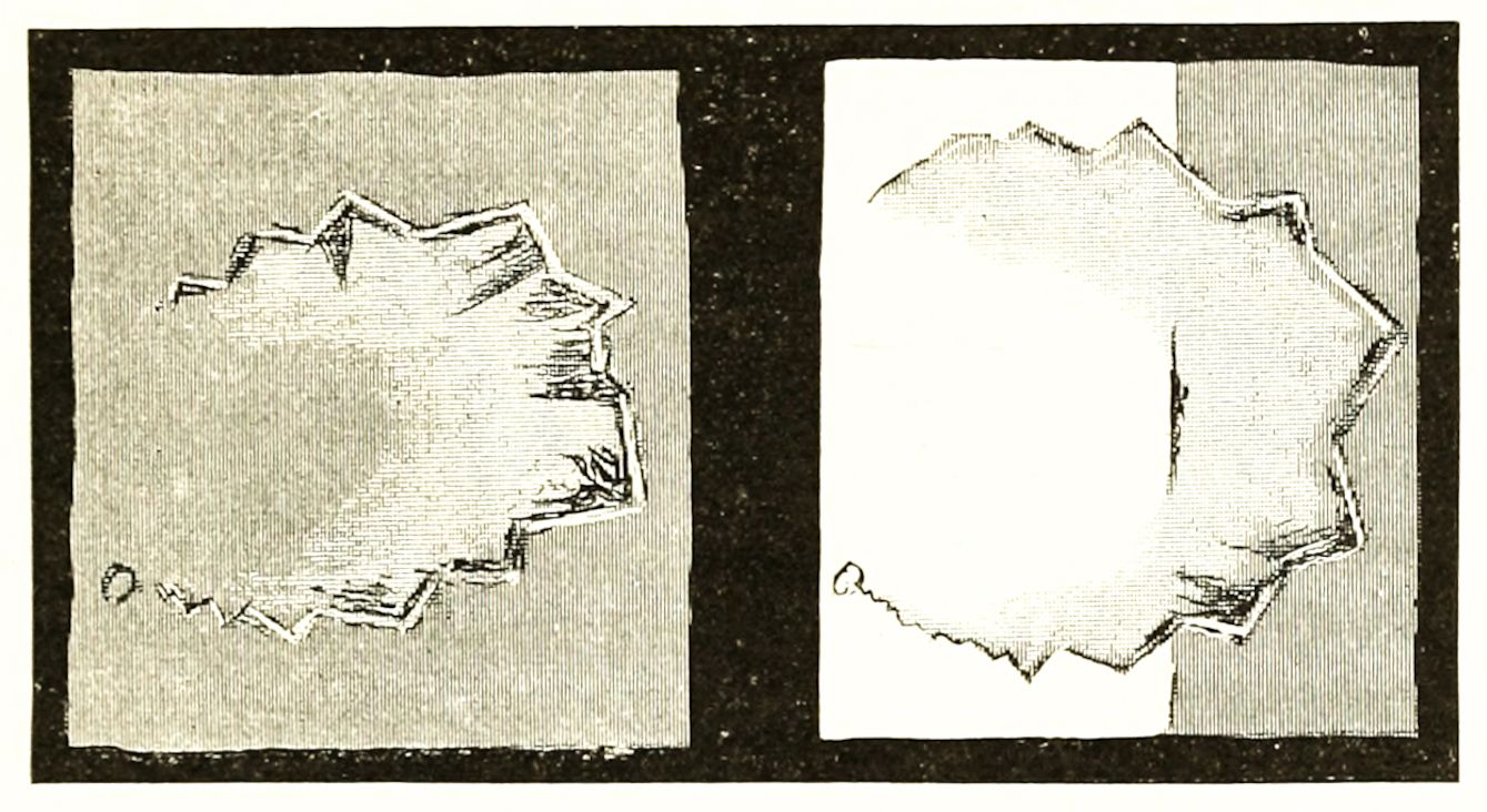 Two rectangular frames each containing a jagged, irregular shape resembling a torn or fractured edge.