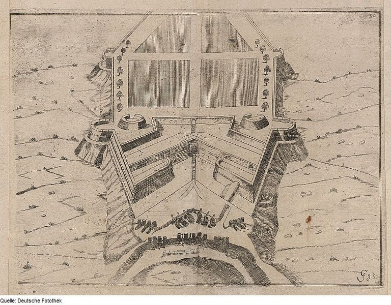 Vintage black and white engraving of a star-shaped fortification with towers, walls, and a surrounding moat.