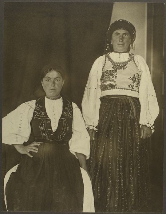 Black and white photograph of two women in traditional clothing.