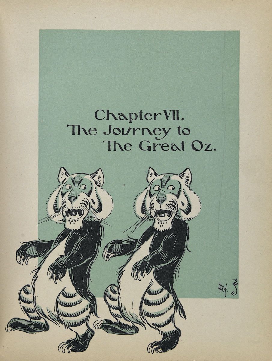 Vintage illustration of two tigers with the chapter title 'Chapter VII. The Journey to The Great Oz.' above them.