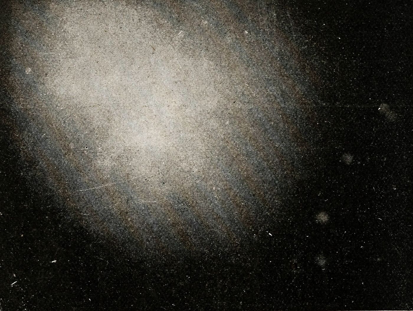 A dark, grainy image with dust and scratches, resembling an old photograph.