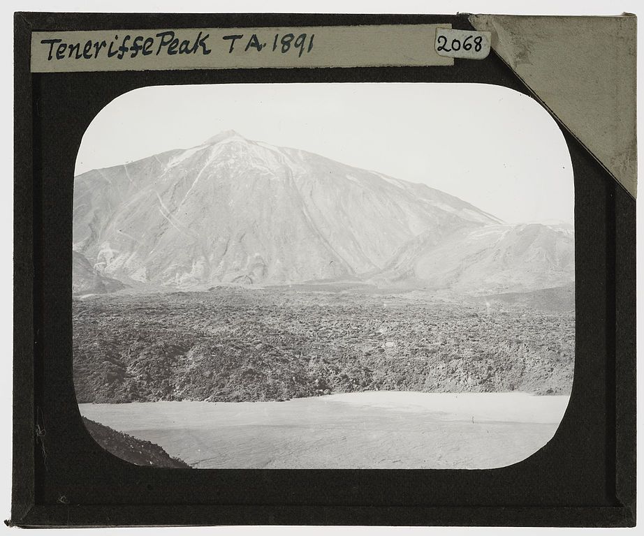Black and white photograph of a mountain peak, labeled 'Teneriffe Peak T.A. 1891', with a rugged landscape and overcast sky.