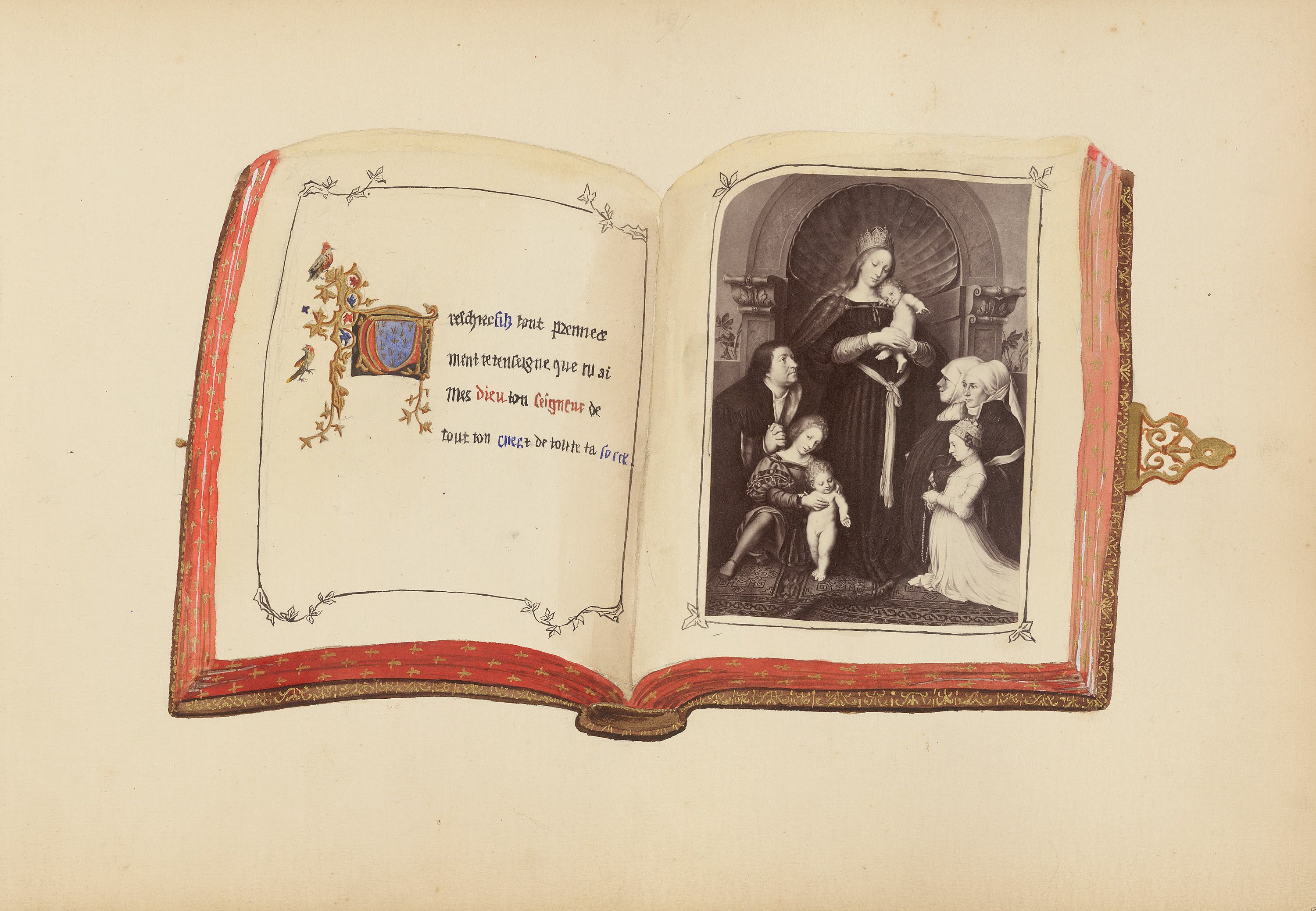 An open antique book with a miniature painting of the Holy Family inside. The book has a red leather cover with ornate gold detailing. The pages are aged and slightly yellowed. The painting depicts a religious scene, likely the Holy Family. On the left page, there is text written in an old script, along with a small coat of arms decorated with gold and colors.