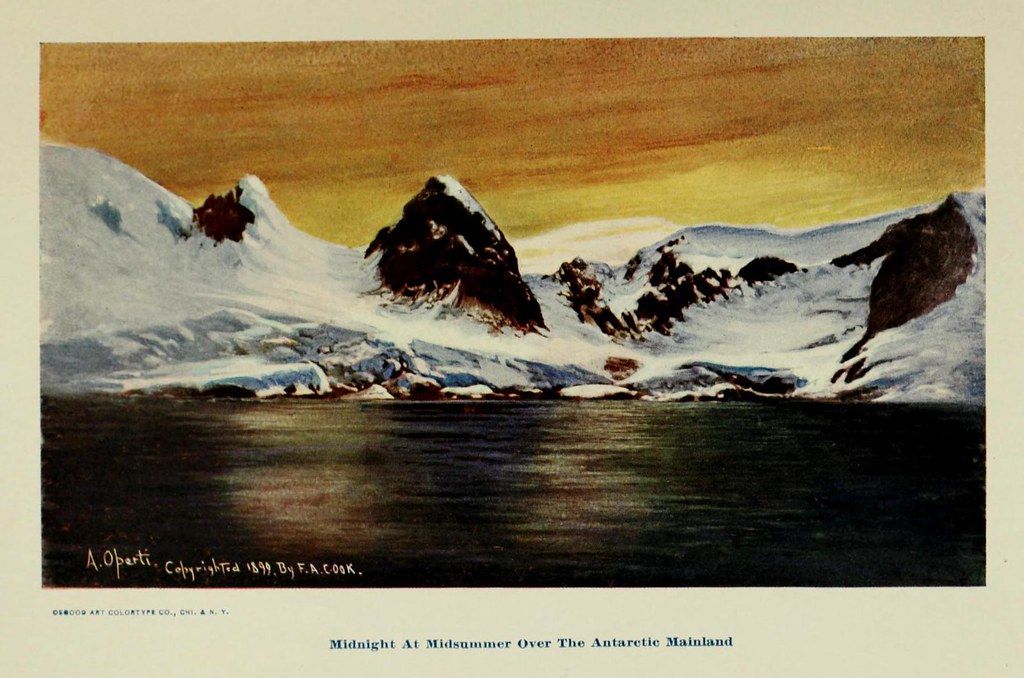 A vintage color lithograph titled "Midnight at Midsummer Over The Antarctic Mainland," copyrighted in 1899 by F.A. Cook. It depicts a dramatic Antarctic landscape with towering snow-covered mountains, dark choppy water, and a warm, dramatic sky.