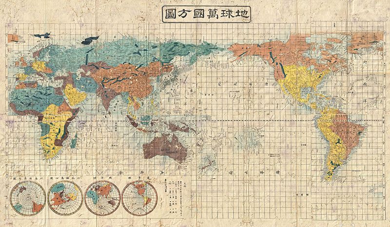 Vintage Japanese world map with color-coded continents and a grid pattern.