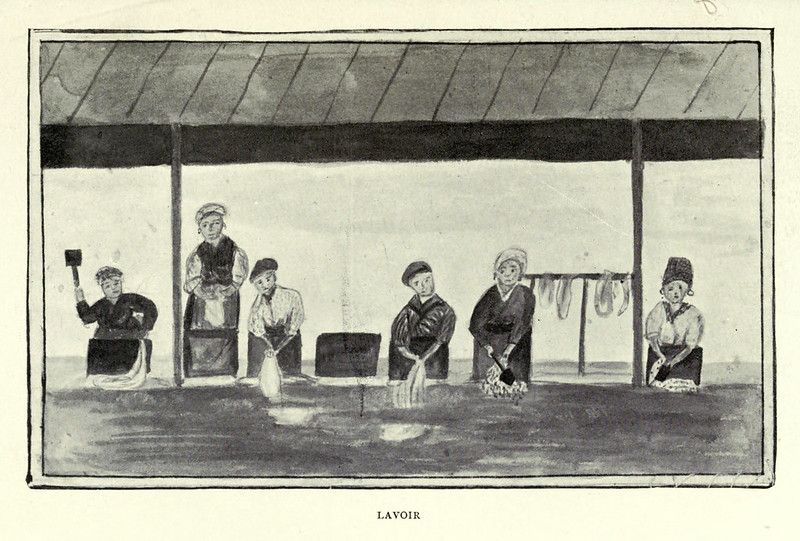 Vintage illustration of a lavoir, showing six women washing clothes in a long trough of water under a simple open-sided structure.