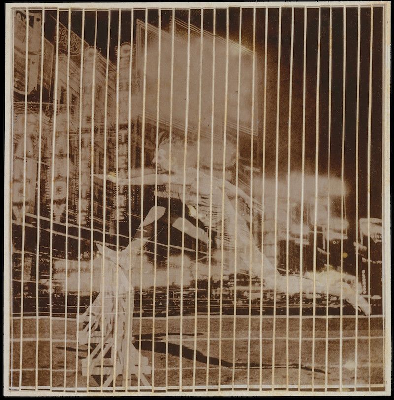 Sepia-toned photograph of a street scene with a grid overlay.