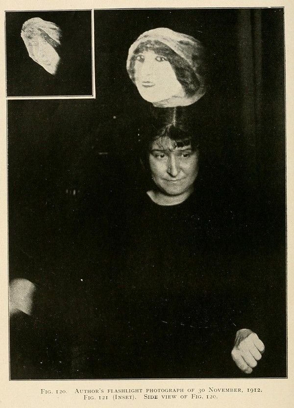 A vintage black and white photograph of a person with their head seemingly floating, illuminated by a flashlight. A smaller inset photograph shows a blurry close-up of the head.