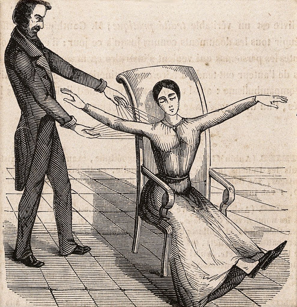 Vintage woodcut illustration of a medical examination with a doctor examining a woman seated in a chair.