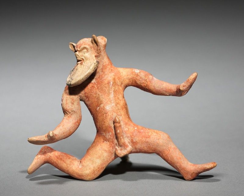 Terracotta sculpture of a running satyr or mythological figure.