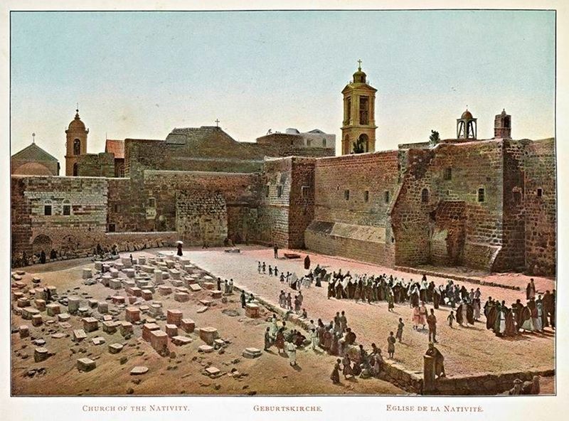 Vintage lithograph of the Church of the Nativity in Bethlehem, showing a stone courtyard filled with people and a massive stone church with towers and domes.