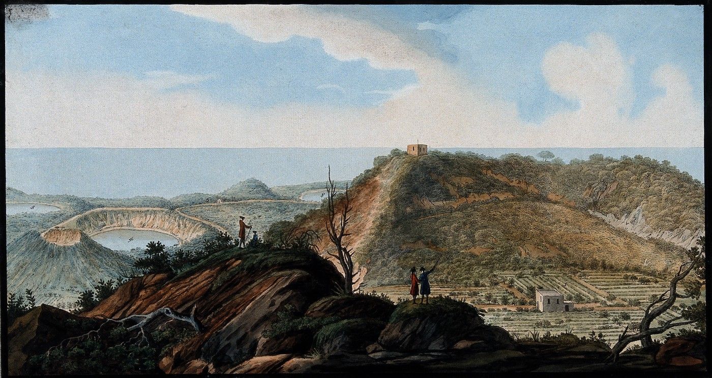 A landscape painting of a mountainous coastal scene with a crater lake and figures in the foreground.