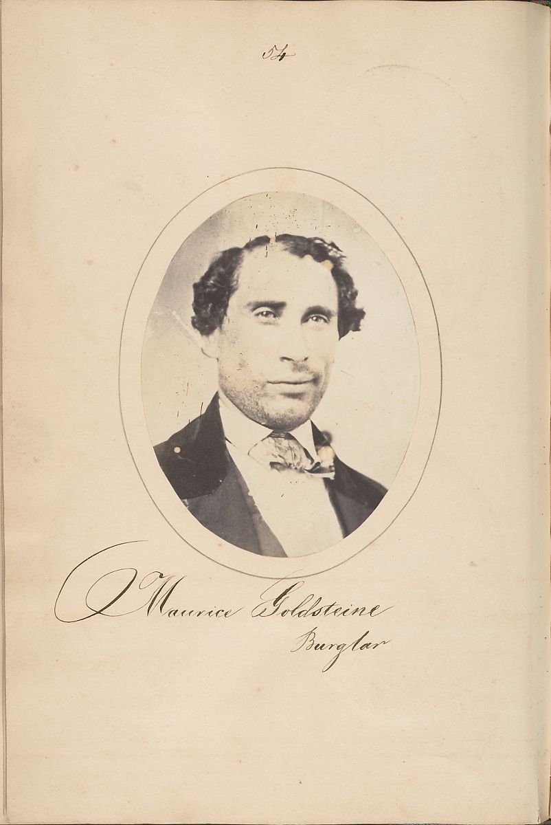 A vintage sepia-toned photograph of a man named Maurice Goldstein, identified as a burglar, mounted on aged paper.