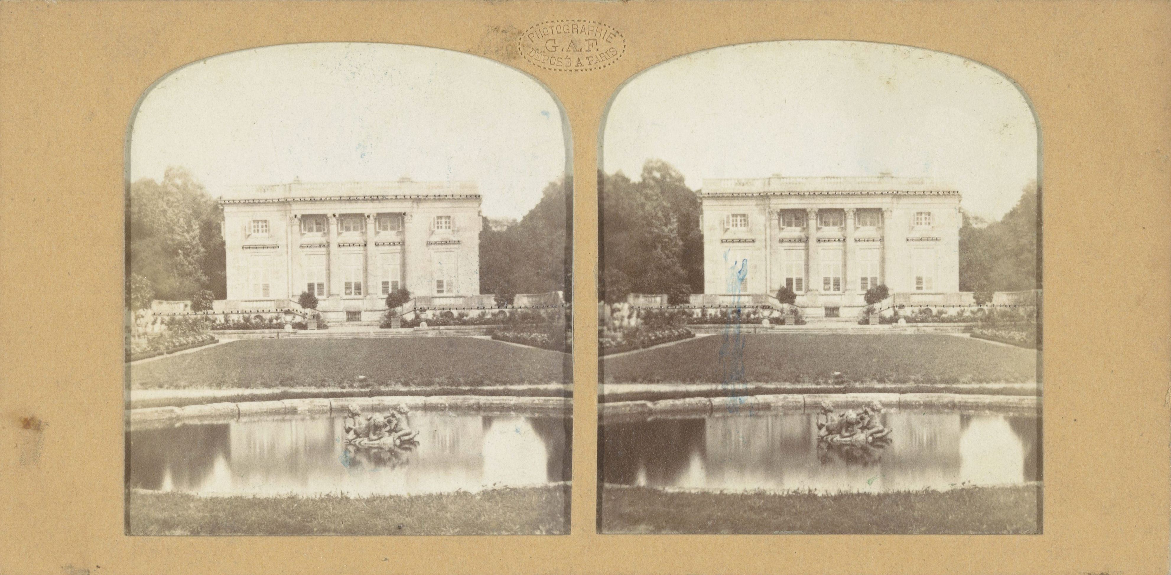 Stereo card photograph of a classical building in a garden with a fountain and people.